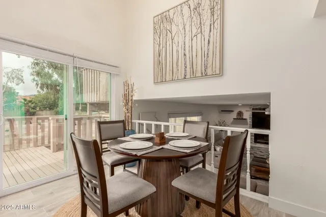 a view of a dining room with furniture and a window