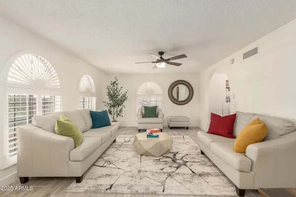 a living room with furniture and a large window