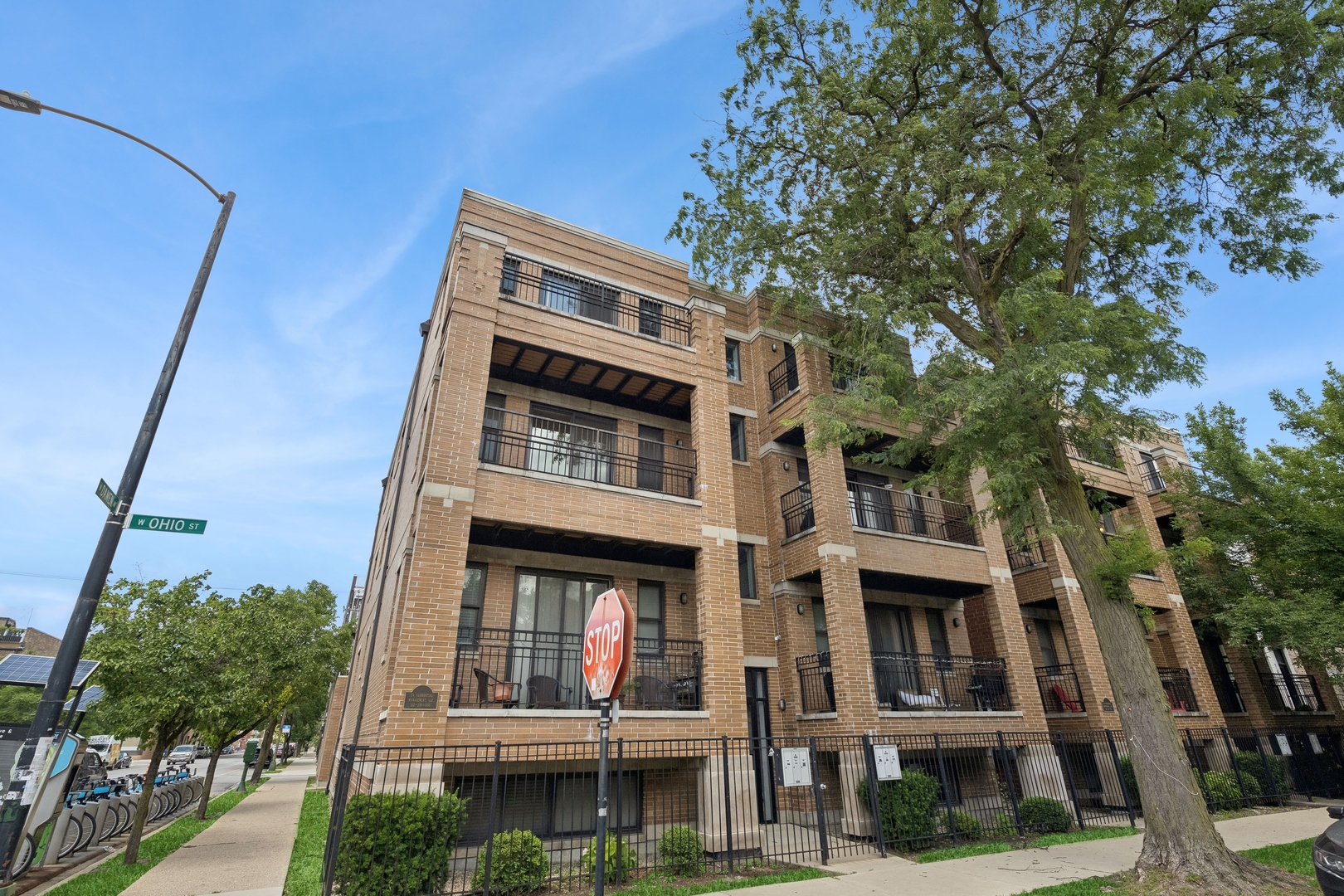 1952 West Ohio Street, Unit 3E Chicago, IL 60622 - Photo 1 of 27 a front view of a building with a tree