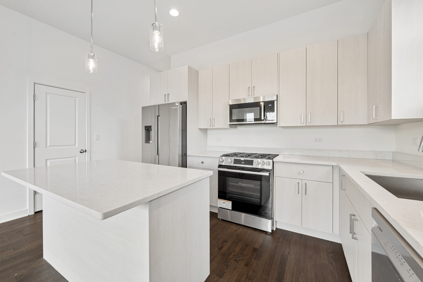 1952 West Ohio Street, Unit 3E Chicago, IL 60622 - Photo 13 of 27 a kitchen with stainless steel appliances granite countertop a sink stove and refrigerator