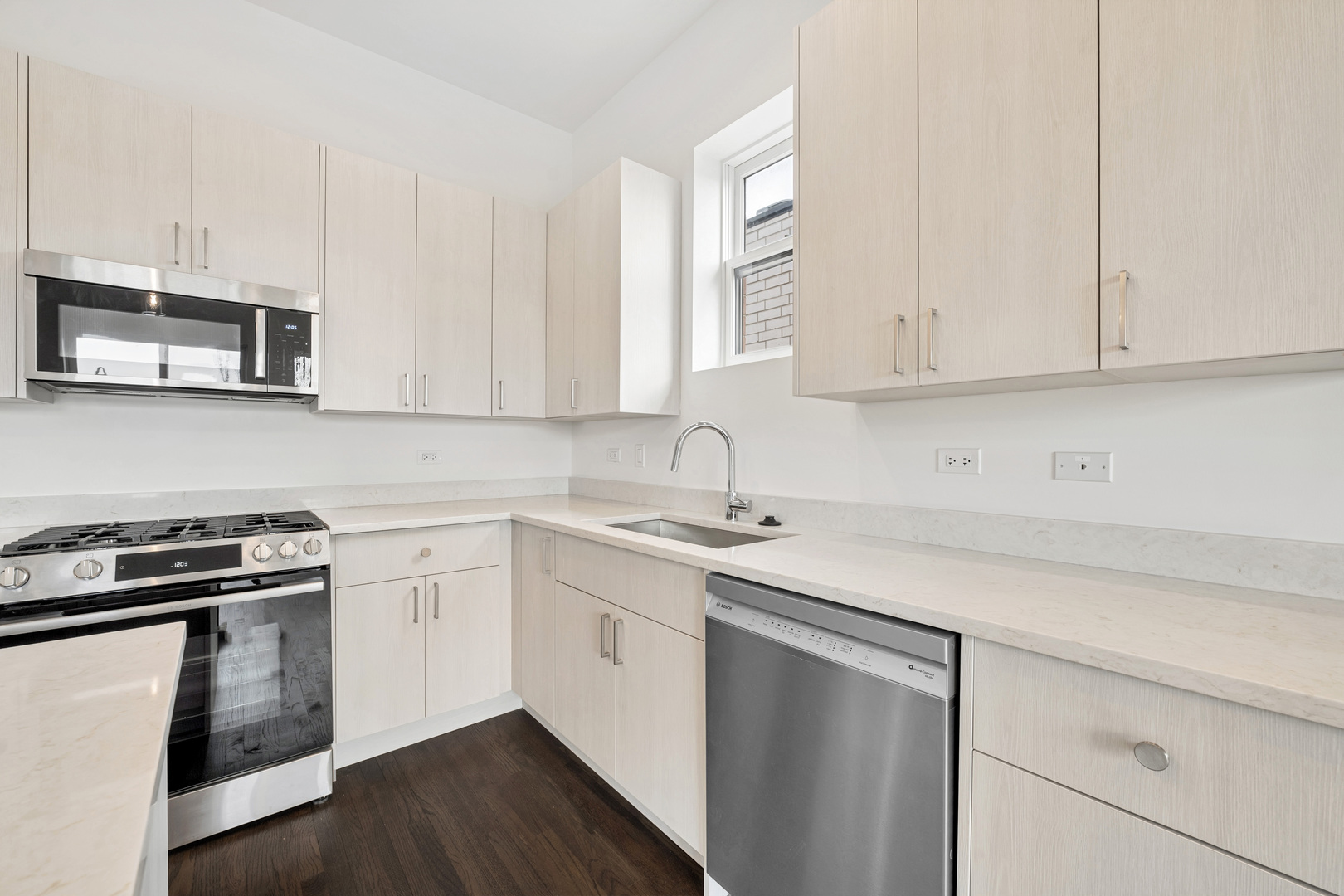 1952 West Ohio Street, Unit 3E Chicago, IL 60622 - Photo 14 of 27 a kitchen with stainless steel appliances granite countertop a sink a stove and cabinets