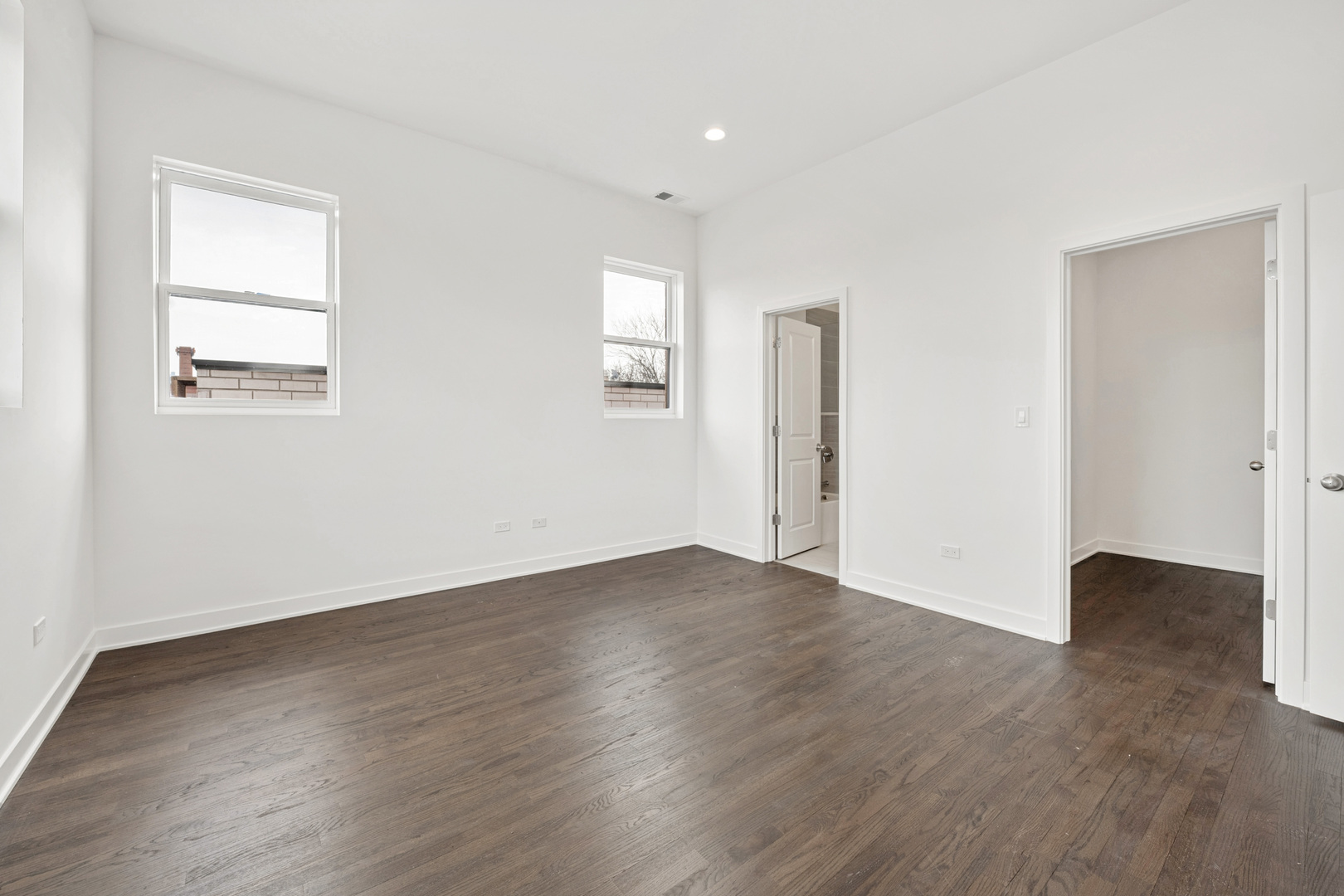 1952 West Ohio Street, Unit 3E Chicago, IL 60622 - Photo 17 of 27 a view of an empty room with wooden floor and a window