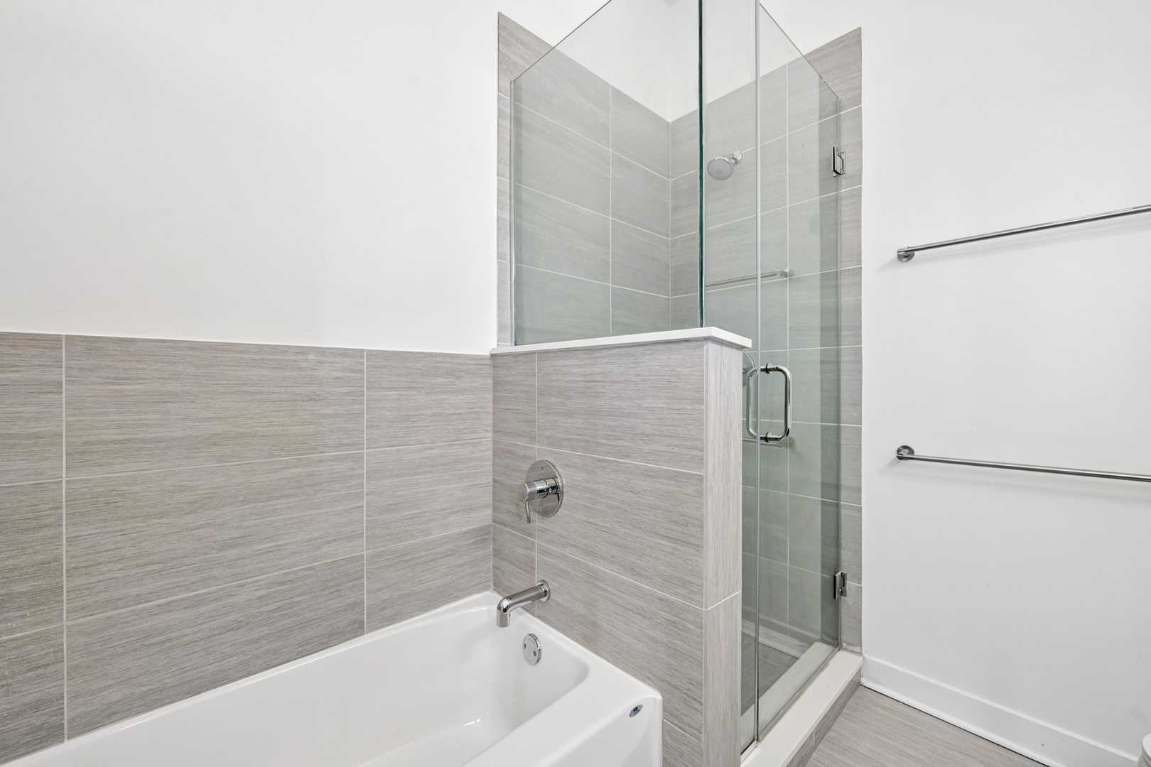 1952 West Ohio Street, Unit 3E Chicago, IL 60622 - Photo 19 of 27 a bathroom with a bathtub and shower