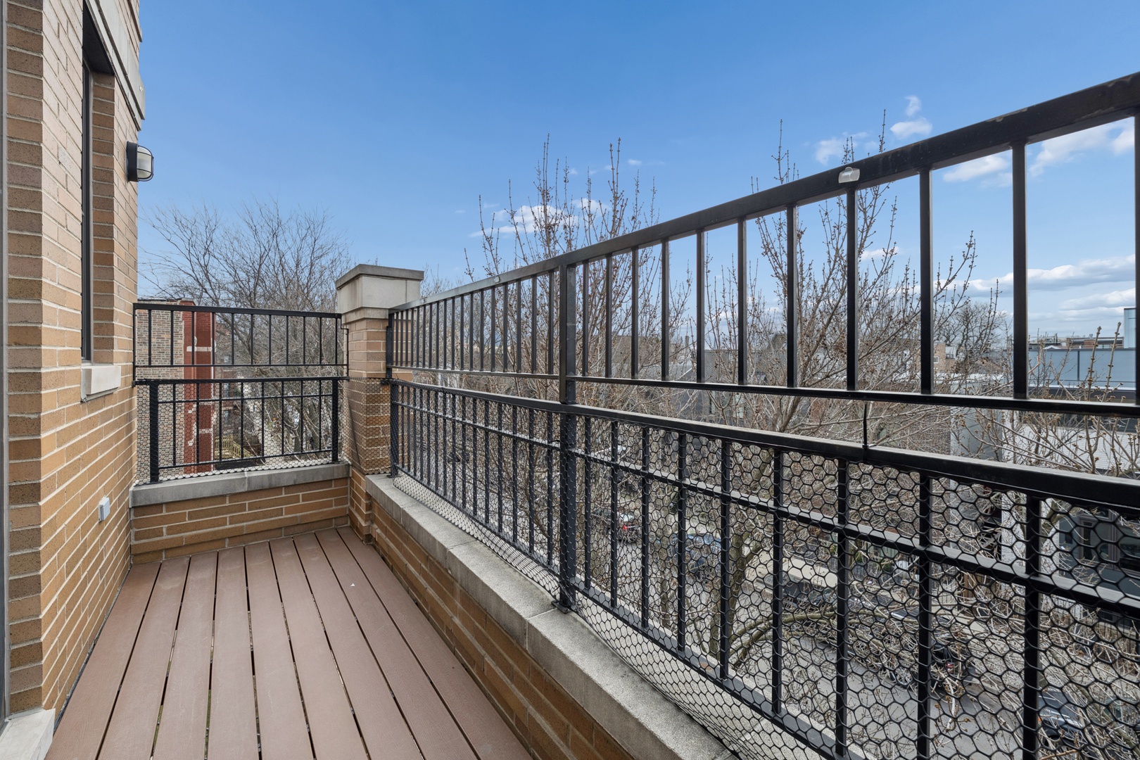 1952 West Ohio Street, Unit 3E Chicago, IL 60622 - Photo 26 of 27 a view of balcony with wooden floor