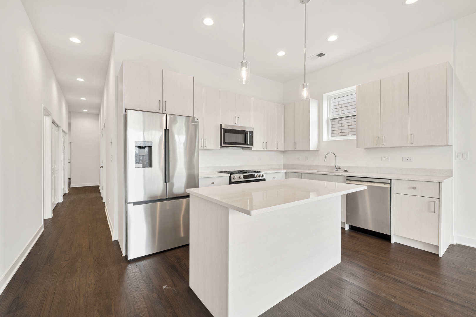 1952 West Ohio Street, Unit 3E Chicago, IL 60622 - Photo 9 of 27 a kitchen with white cabinets and stainless steel appliances