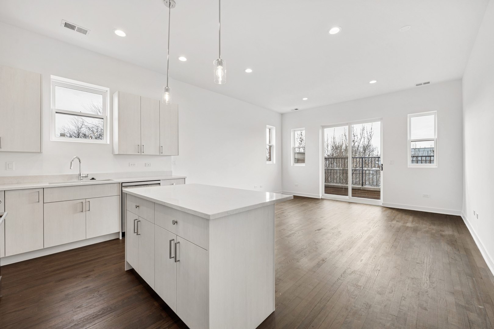 1952 West Ohio Street, Unit 3E Chicago, IL 60622 - Photo 10 of 27 a view of a kitchen with a sink and wooden floor