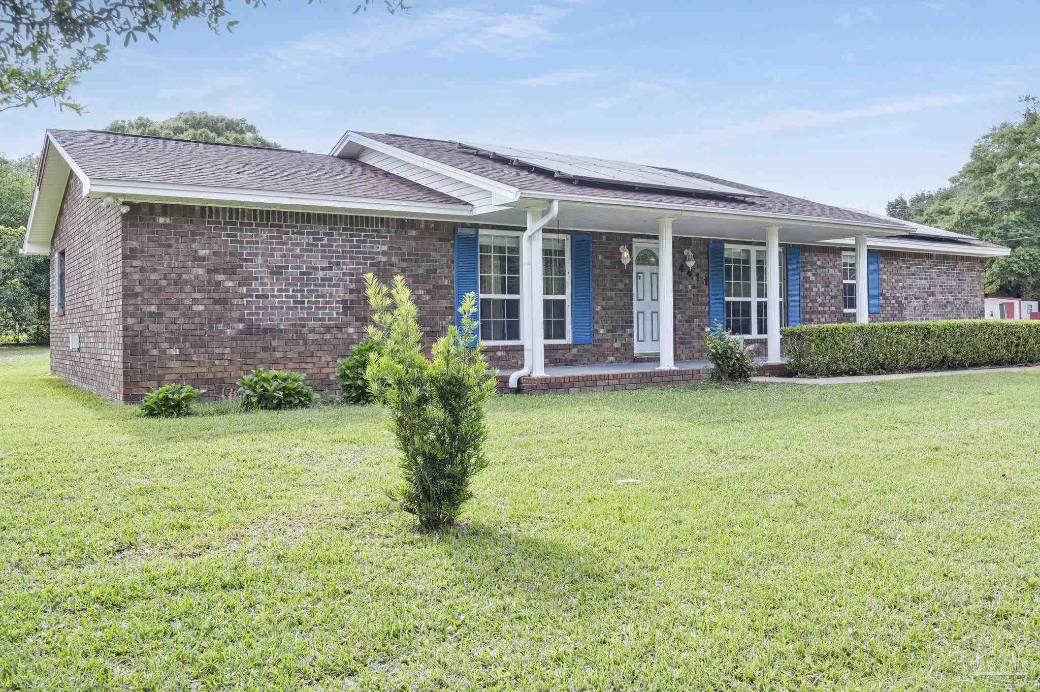 4411 Pace Lane Pace, FL 32571 - Photo 2 of 68 front view of a house with a yard