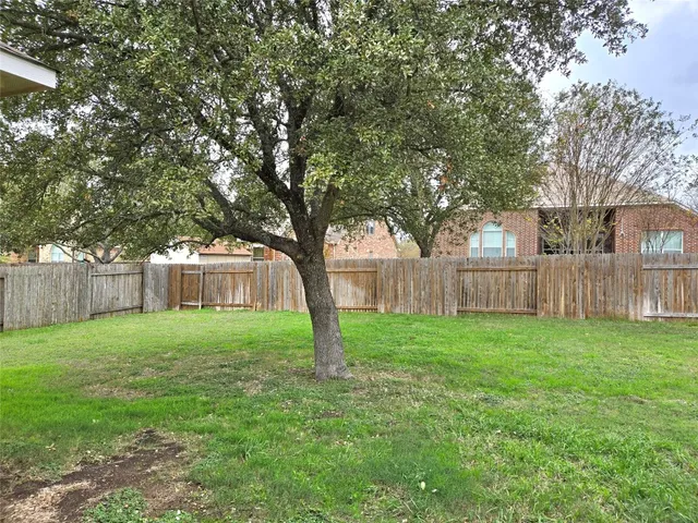 a view of a backyard with a garden
