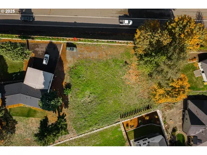 a front view of a house with a garden and pathway
