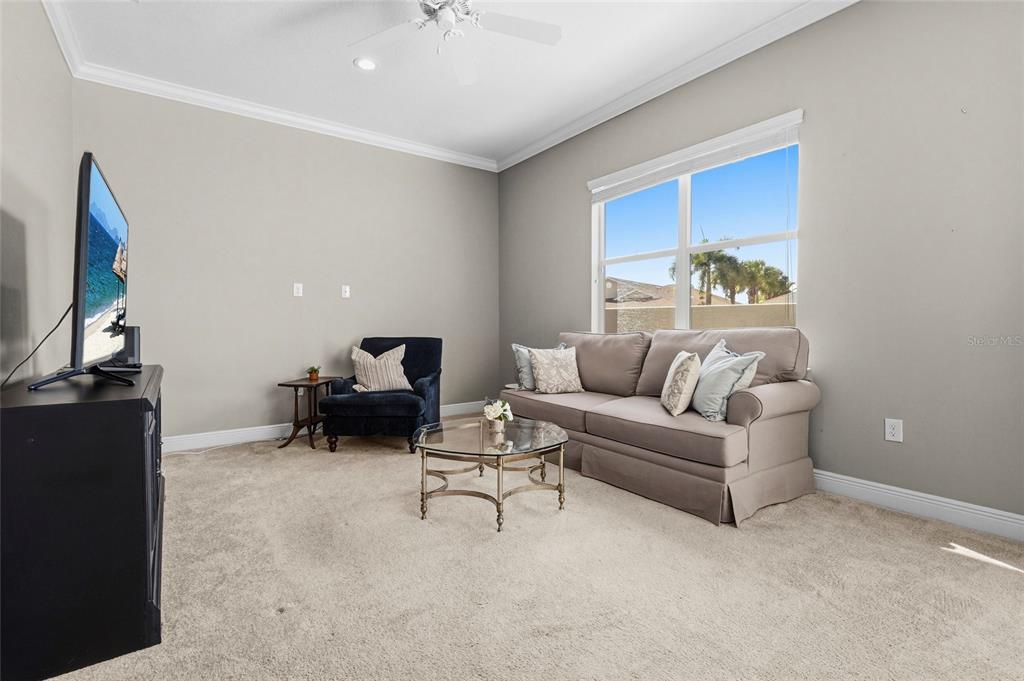 357 Marsh Creek Road Venice, FL 34292 - Photo 36 of 70 a living room with furniture and a flat screen tv