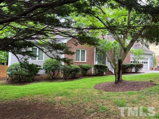 4121 Starboard Court Raleigh, NC 27613 - Photo 1 of 45 a front view of a house with garden