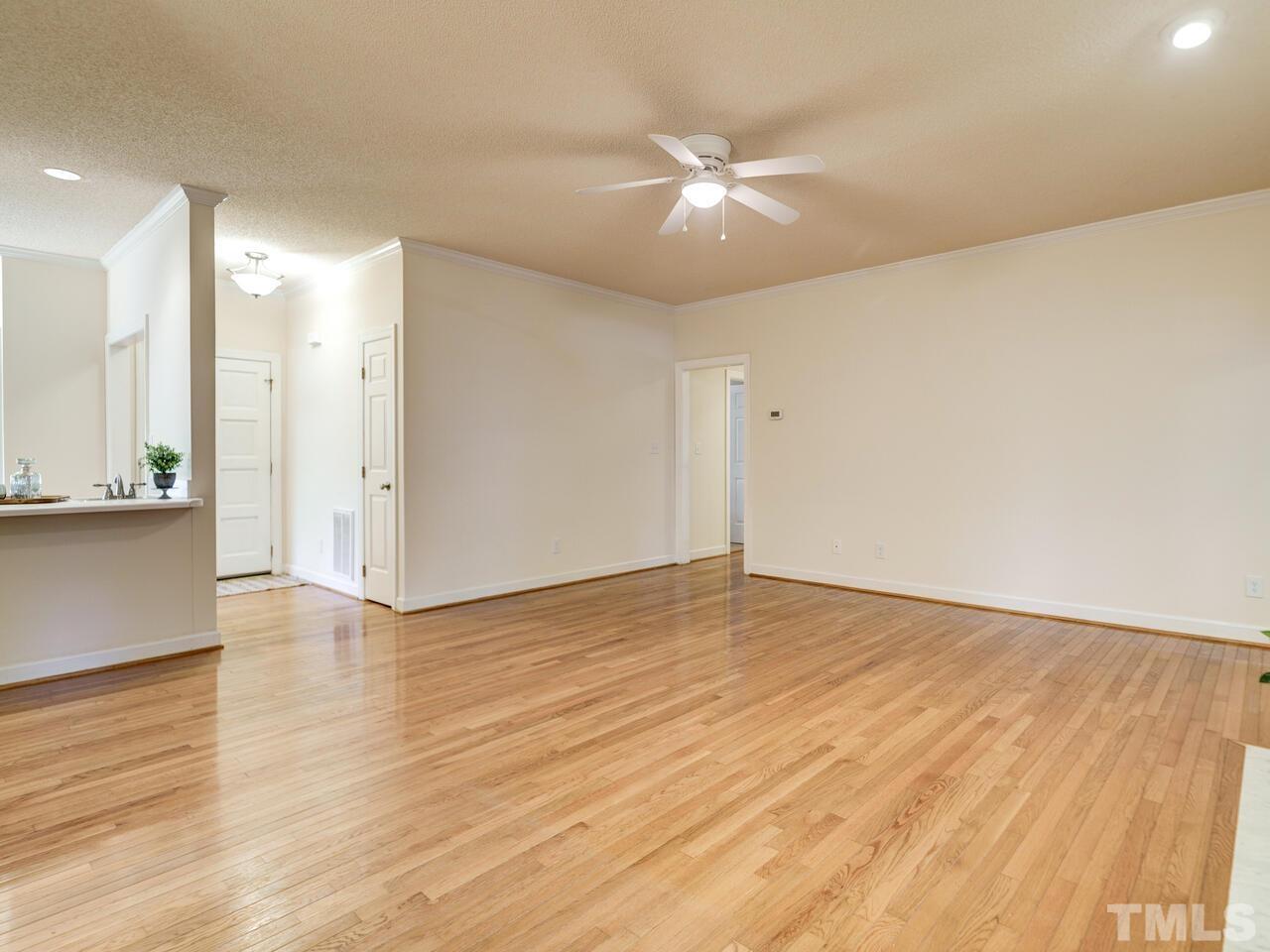 4121 Starboard Court Raleigh, NC 27613 - Photo 12 of 45 a view of an empty room with wooden floor and a window