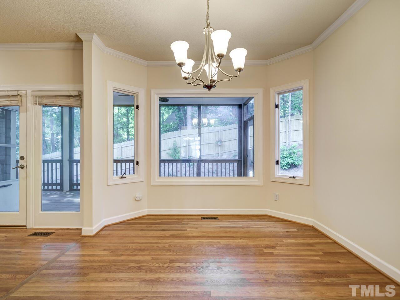 4121 Starboard Court Raleigh, NC 27613 - Photo 13 of 45 a view of an empty room with wooden floor and a window