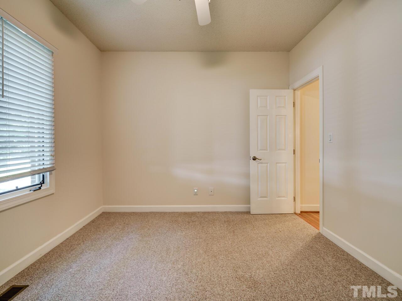 4121 Starboard Court Raleigh, NC 27613 - Photo 25 of 45 an empty room with windows