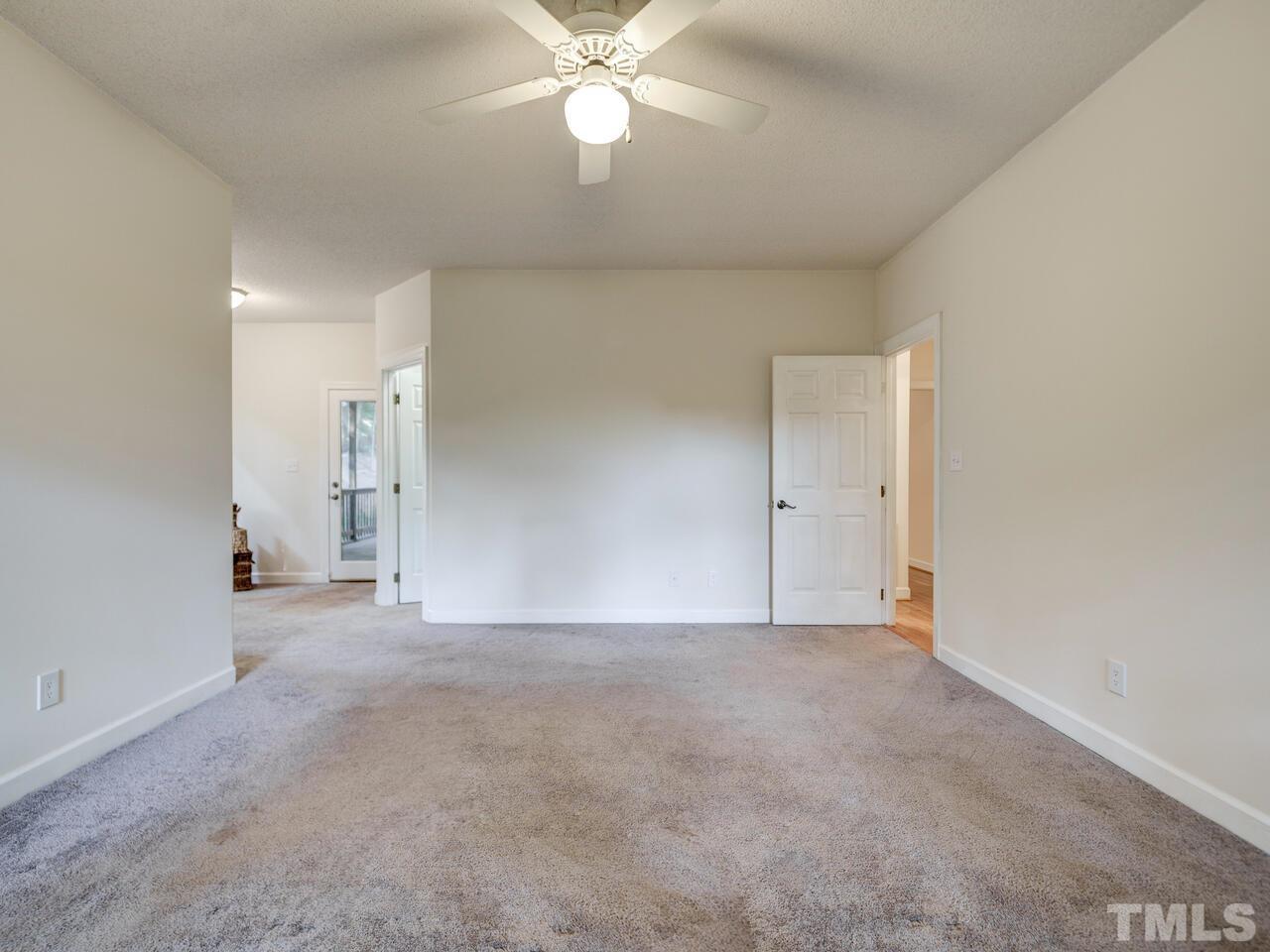 4121 Starboard Court Raleigh, NC 27613 - Photo 32 of 45 a view of an empty room with a ceiling fan