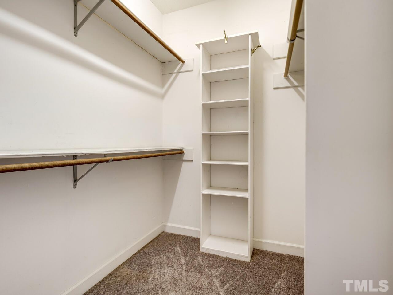 4121 Starboard Court Raleigh, NC 27613 - Photo 38 of 45 a view of walk in closet with empty racks
