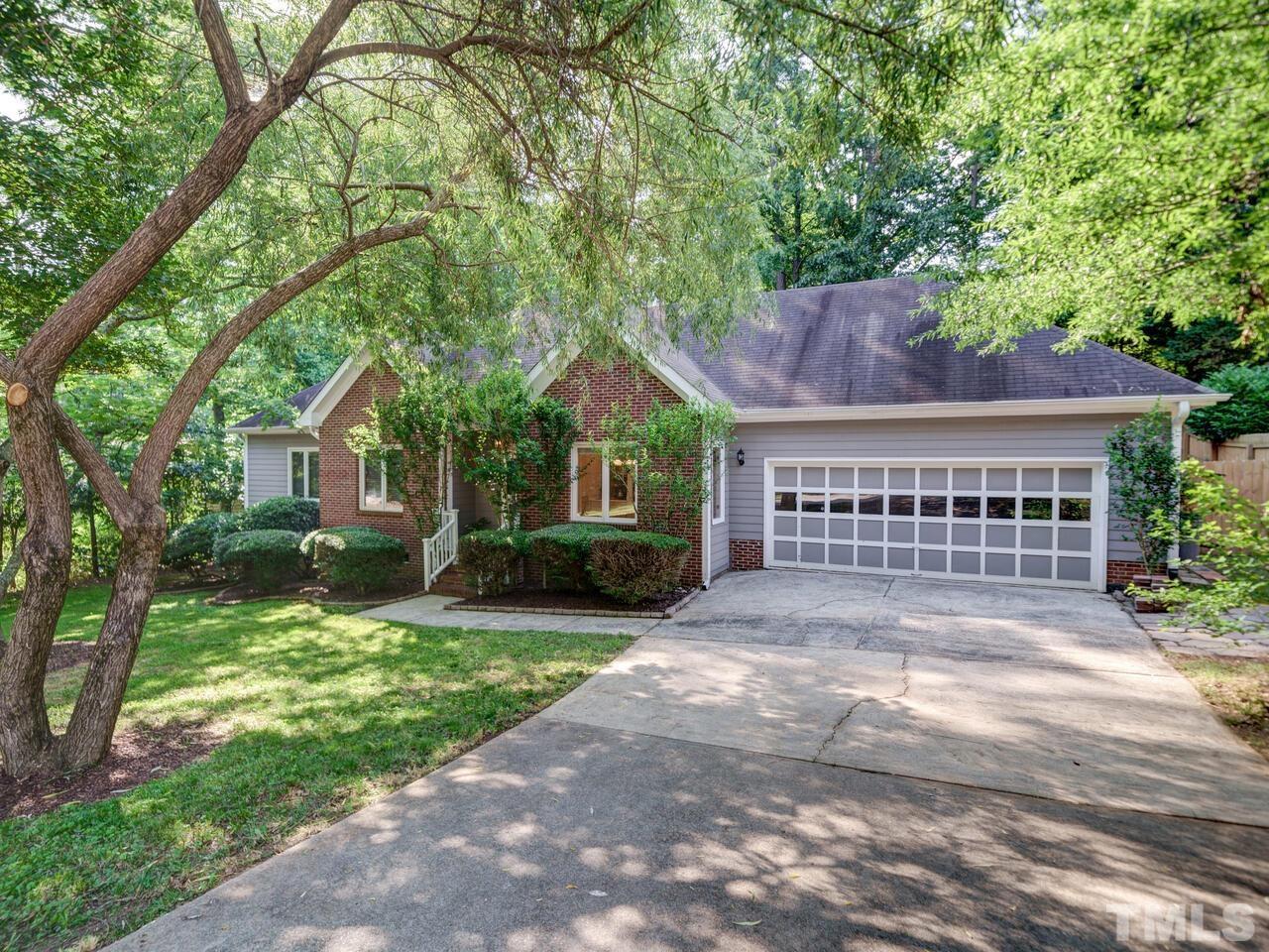 4121 Starboard Court Raleigh, NC 27613 - Photo 4 of 45 a view of house with a yard and potted plants