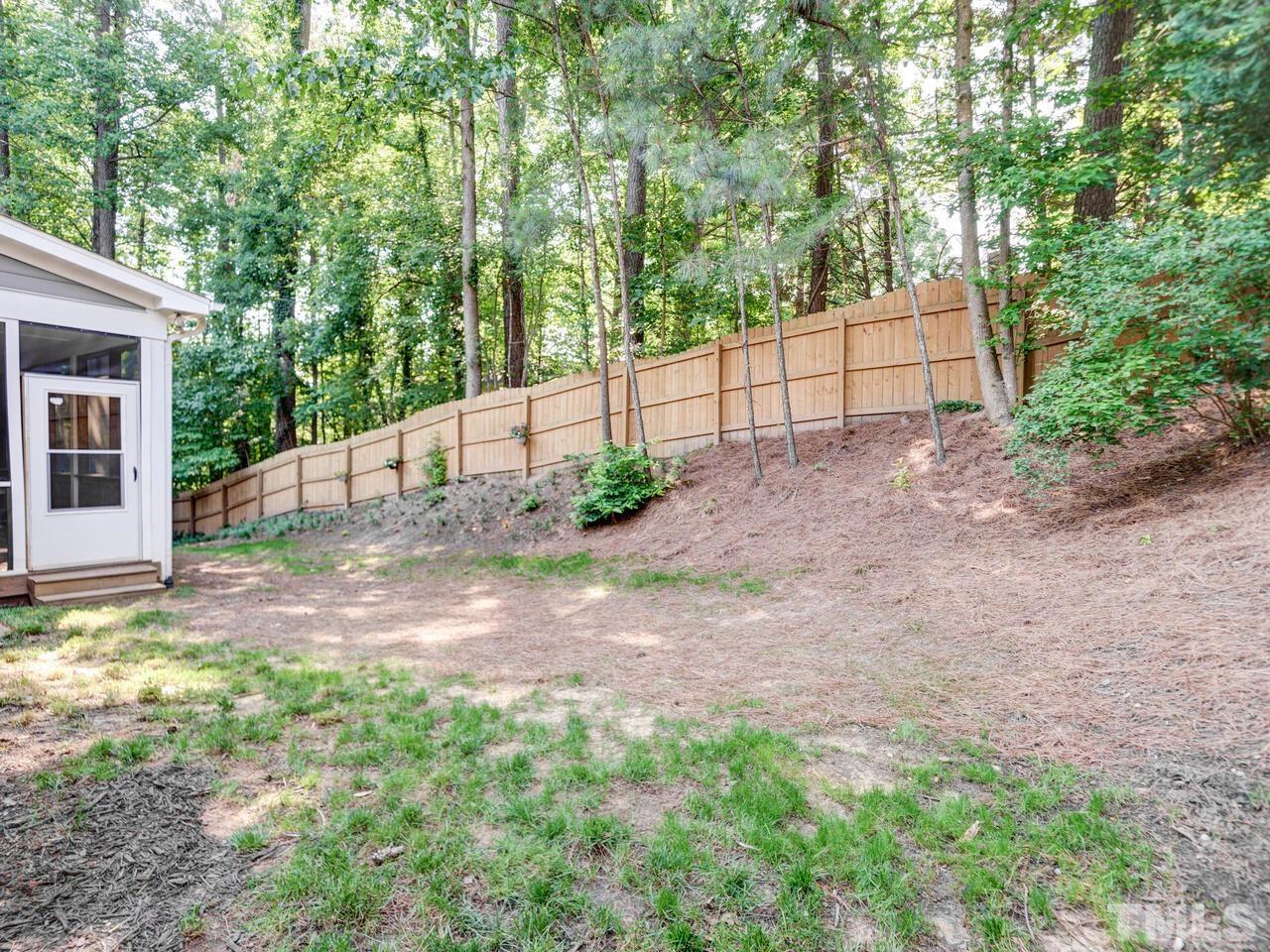 4121 Starboard Court Raleigh, NC 27613 - Photo 41 of 45 a view of backyard and tree