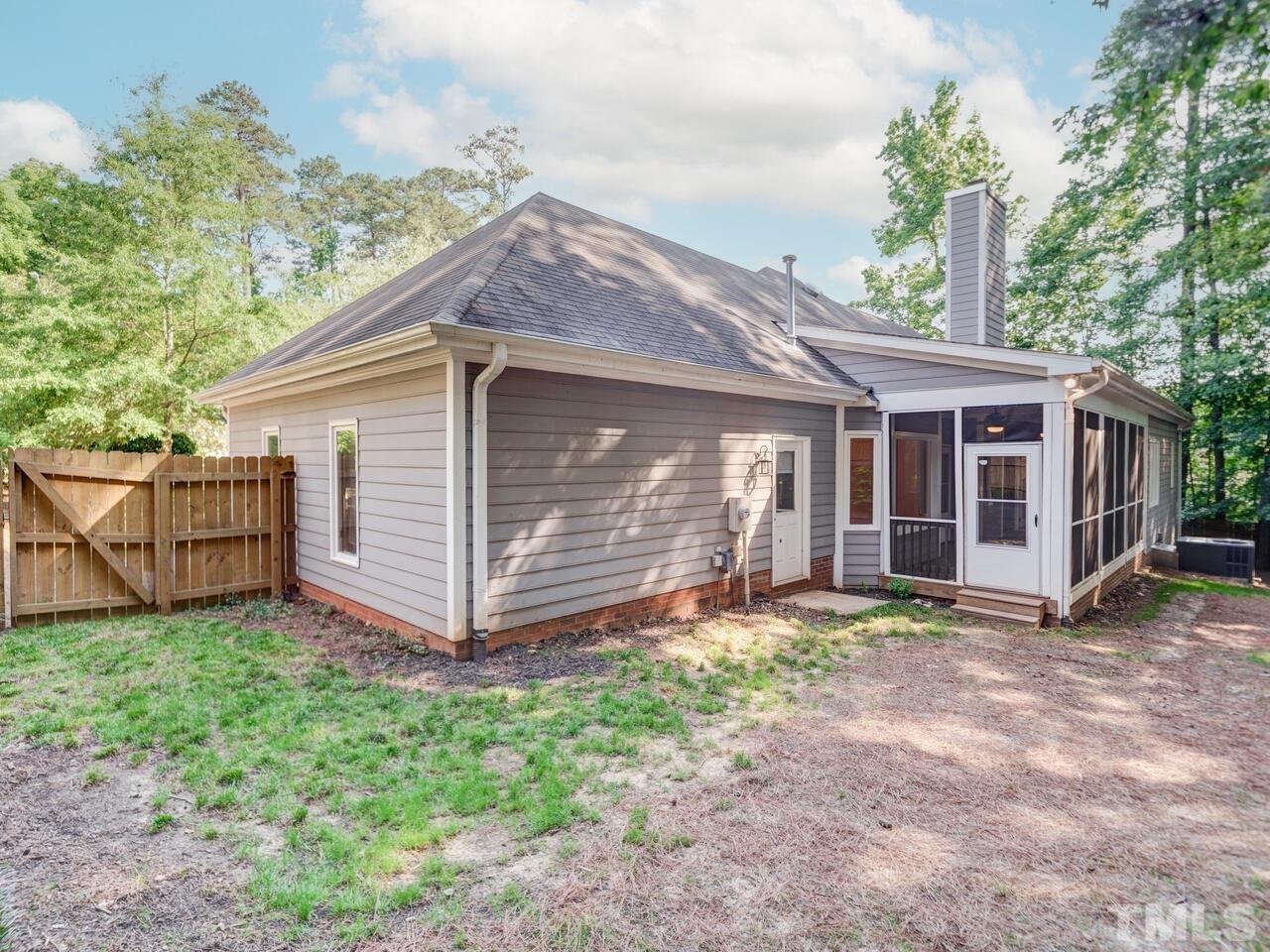 4121 Starboard Court Raleigh, NC 27613 - Photo 42 of 45 a view of a house with a yard and fence