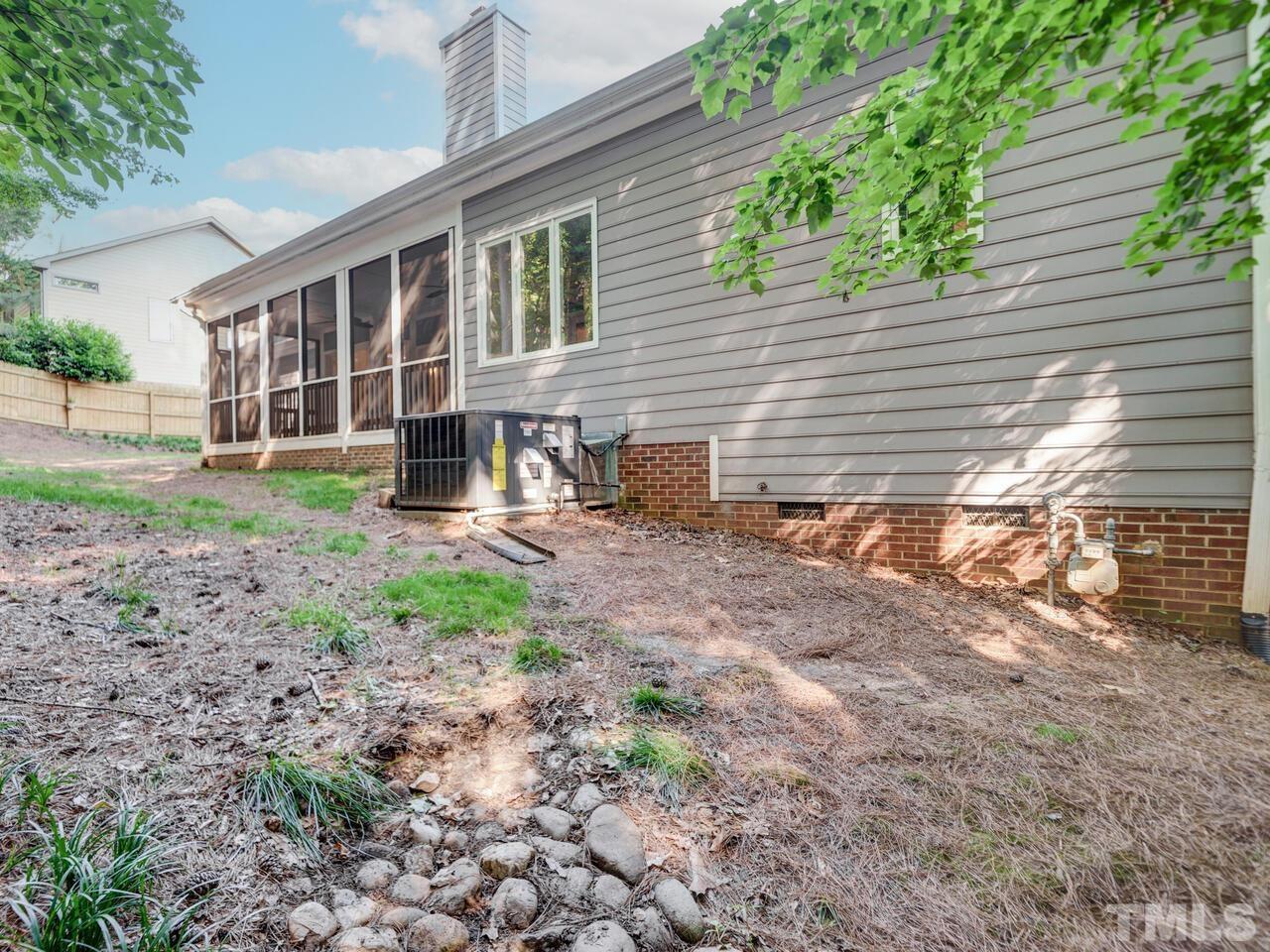 4121 Starboard Court Raleigh, NC 27613 - Photo 43 of 45 a view of a house with backyard and a tree