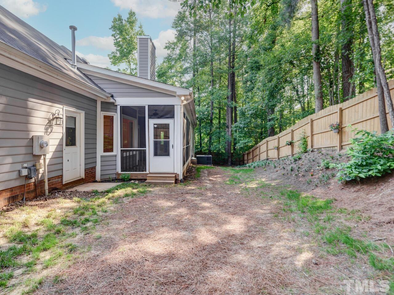 4121 Starboard Court Raleigh, NC 27613 - Photo 44 of 45 a view of a house with backyard and garden