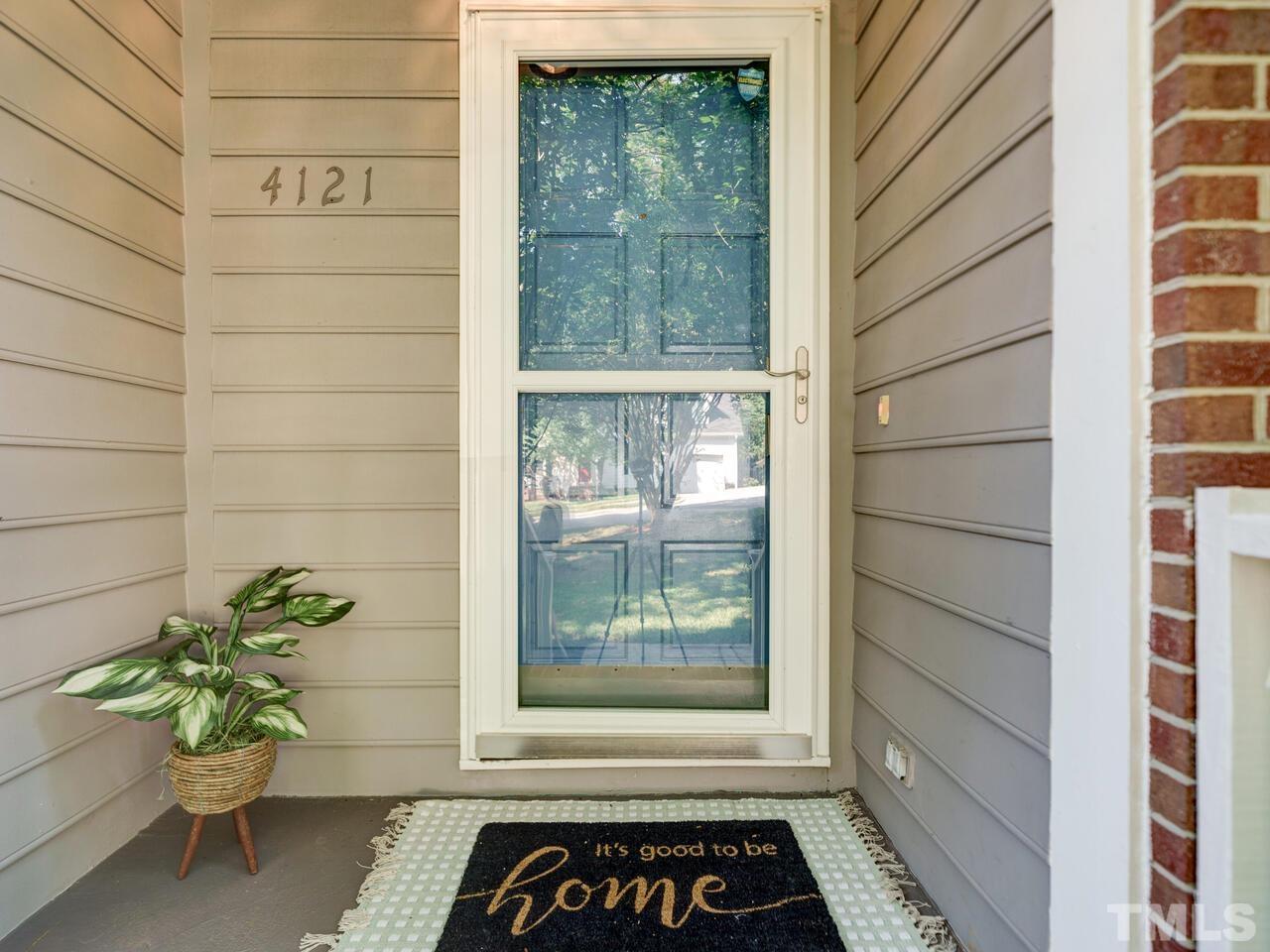 4121 Starboard Court Raleigh, NC 27613 - Photo 5 of 45 a window with a glass door