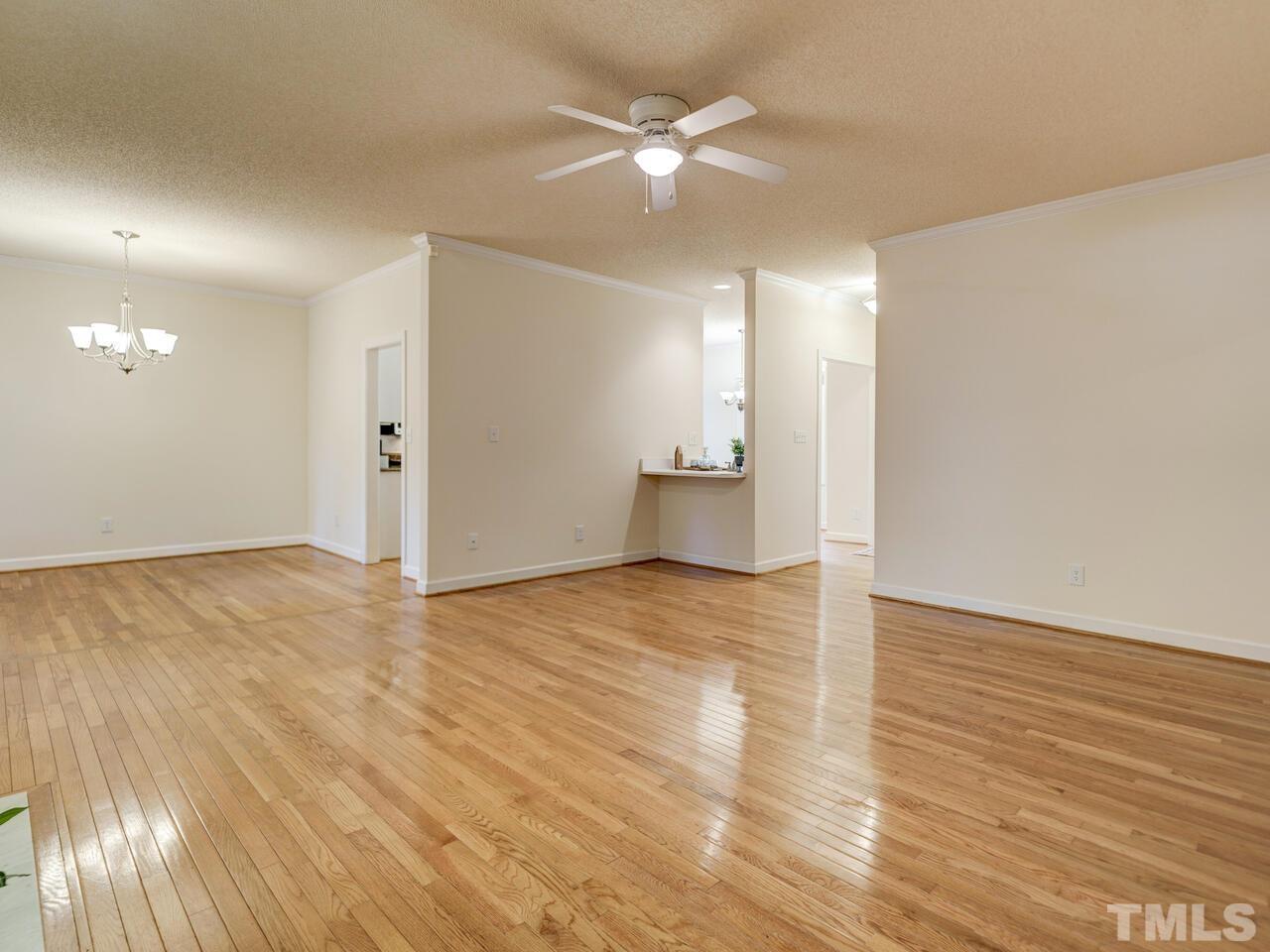 4121 Starboard Court Raleigh, NC 27613 - Photo 10 of 45 a view of empty room with wooden floor and fan