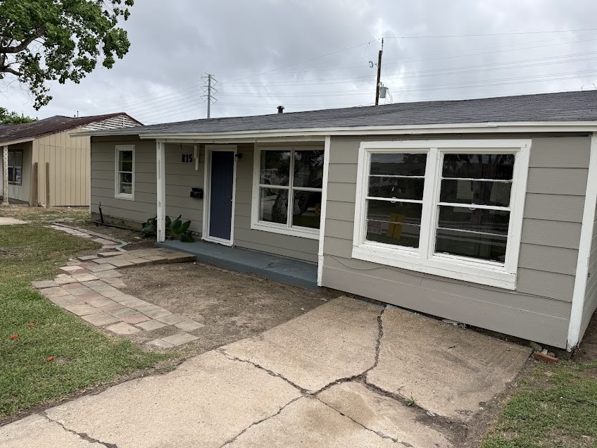 a front view of a house with a large window