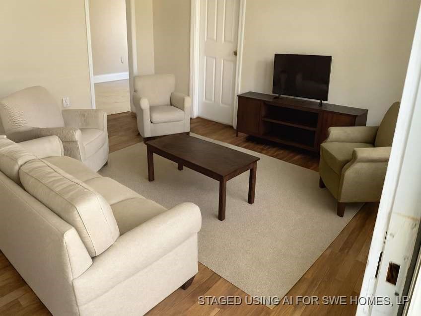 815 West 12th Street Freeport, TX 77541 - Photo 4 of 11 a living room with furniture and a flat screen tv