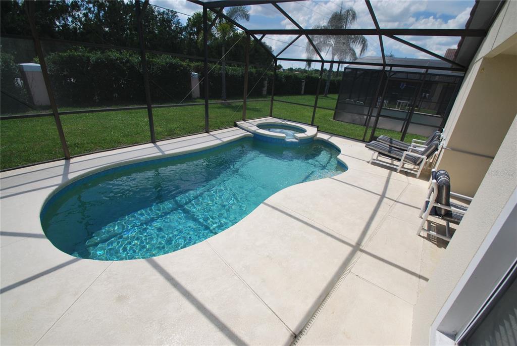 217 Robin Road Davenport, FL 33896 - Photo 3 of 27 a view of a backyard with wooden fence