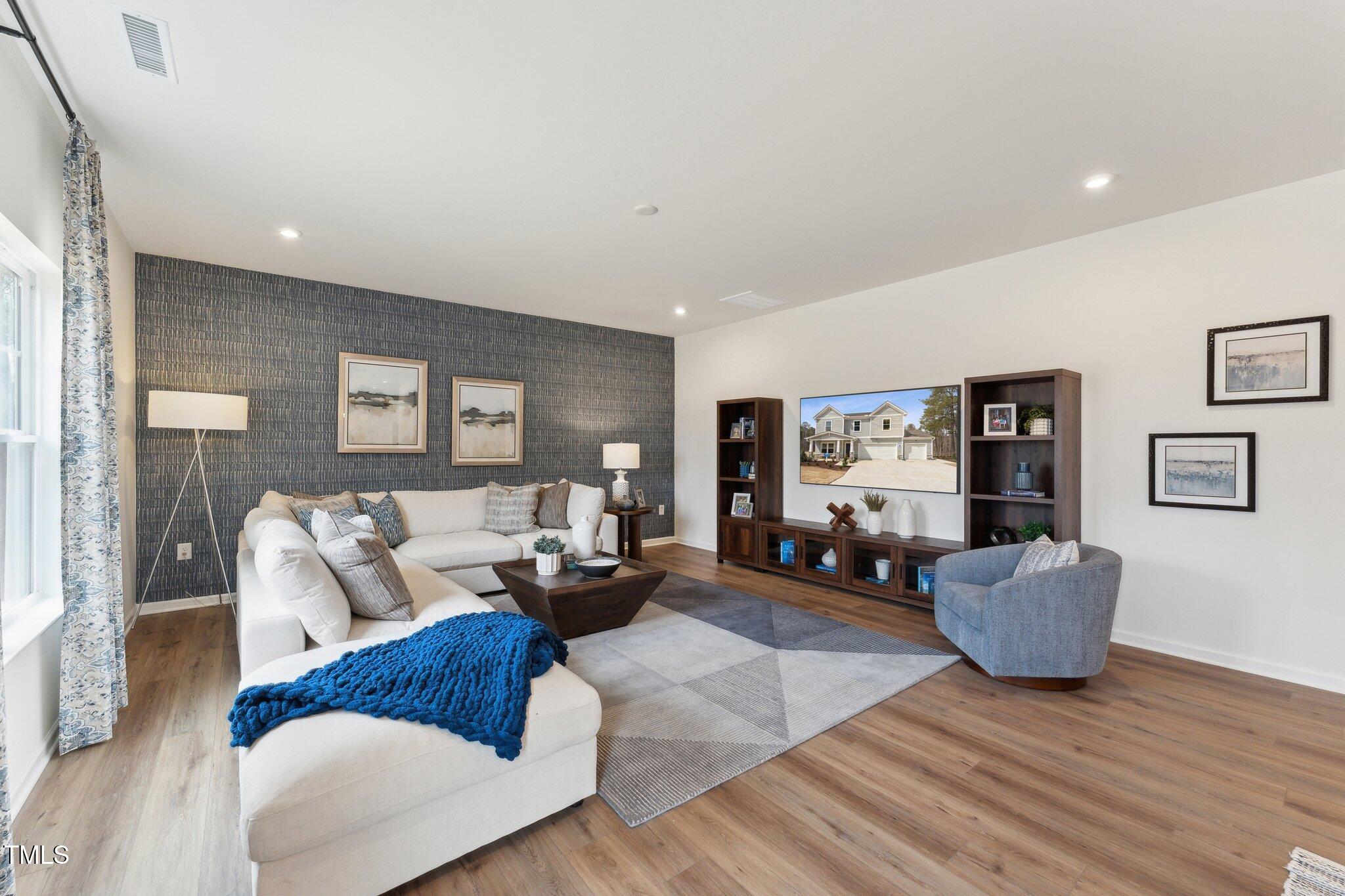27 Cribbs Lane Middlesex, NC 27557 - Photo 11 of 41 a living room with furniture and wooden floor