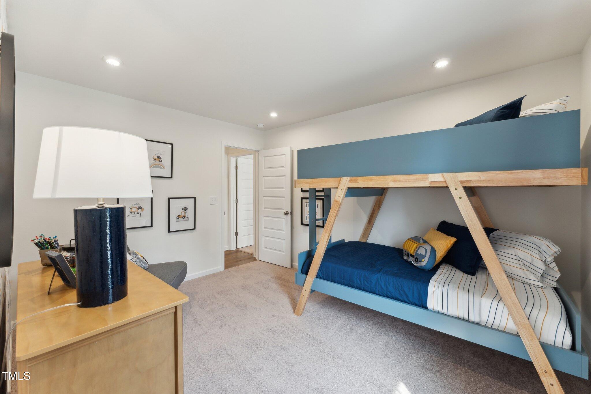 27 Cribbs Lane Middlesex, NC 27557 - Photo 23 of 41 a bedroom with a bed and a flat screen tv