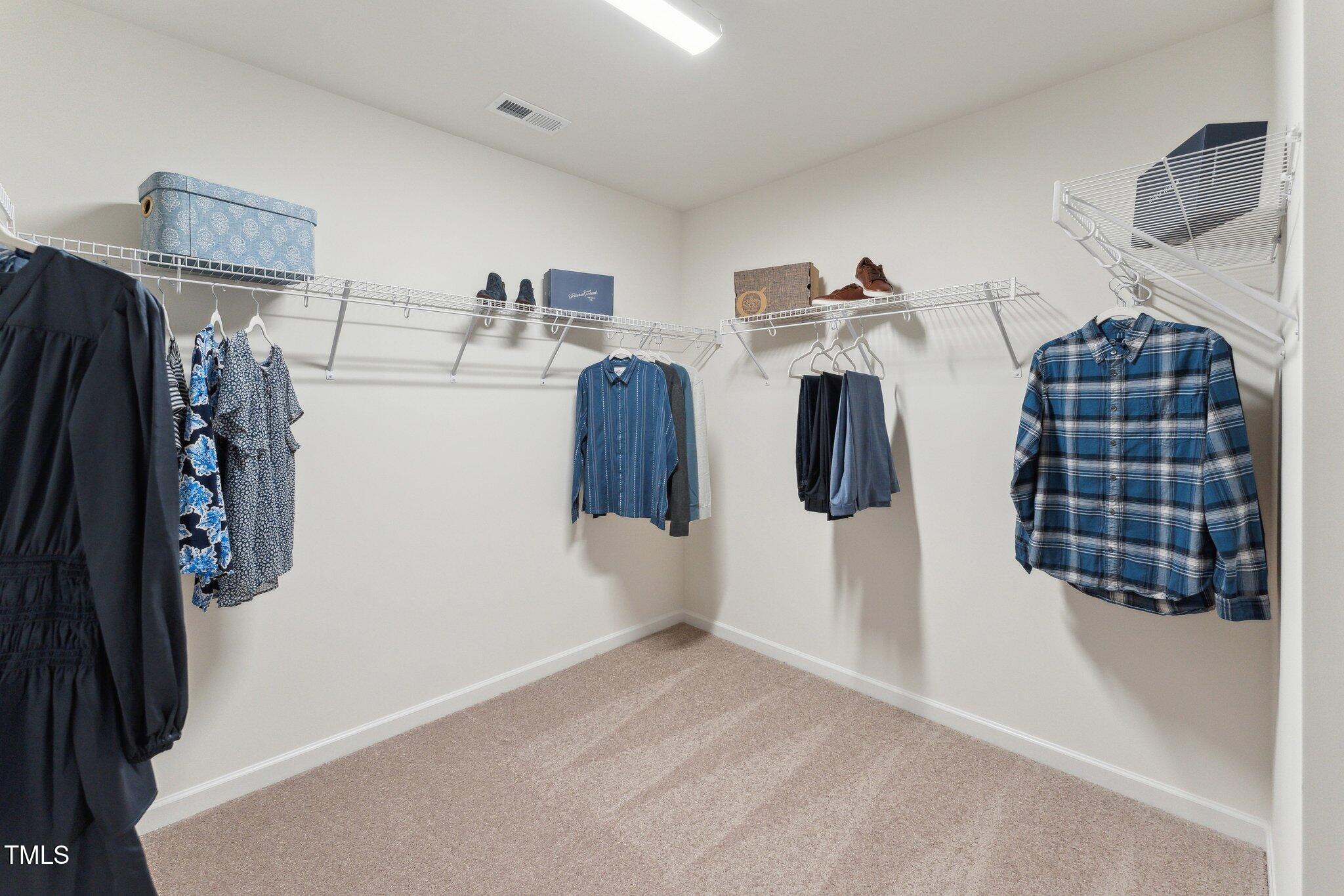 27 Cribbs Lane Middlesex, NC 27557 - Photo 28 of 41 a view of walk in closet with clothes and shoes