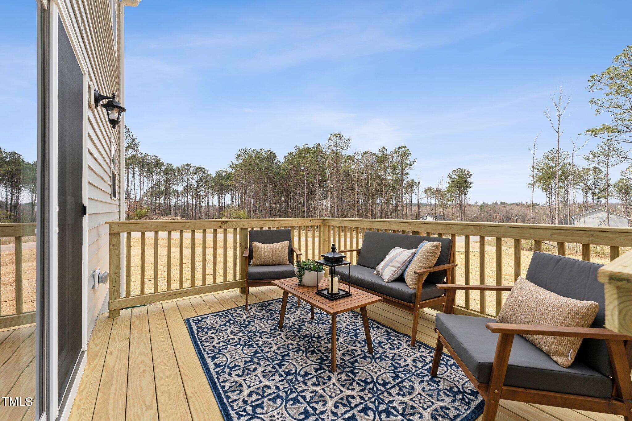 27 Cribbs Lane Middlesex, NC 27557 - Photo 31 of 41 a roof deck with a table and chairs