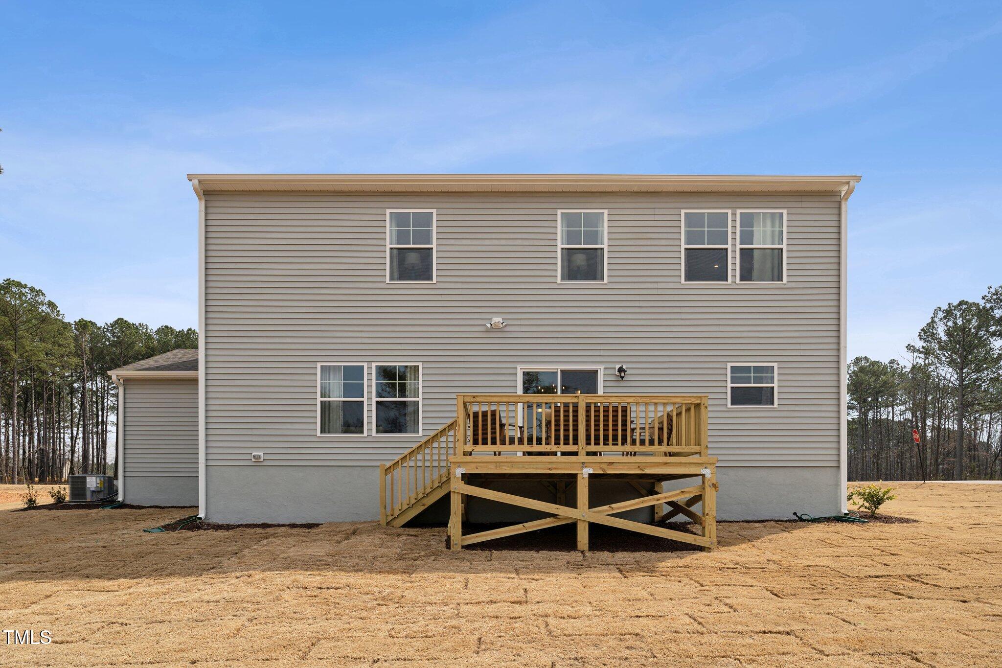 27 Cribbs Lane Middlesex, NC 27557 - Photo 32 of 41 a backyard of a house with dining table and chairs