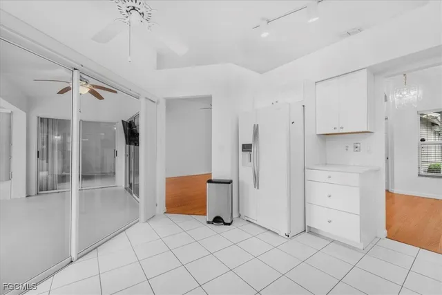 a view of a refrigerator and window