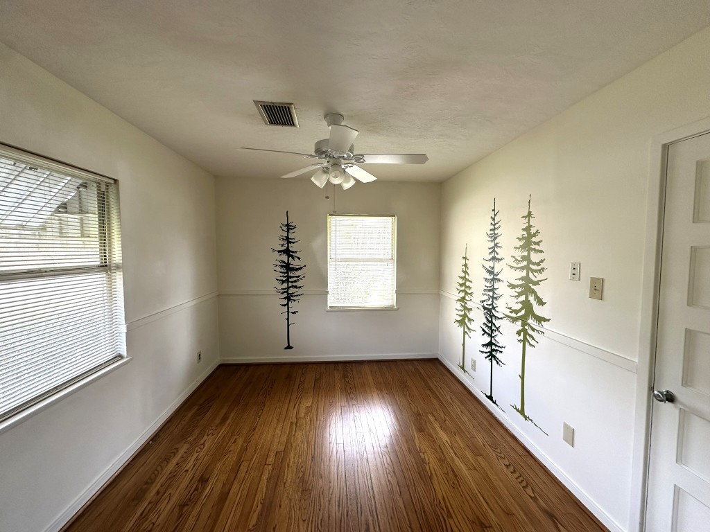 903 Lamonte Lane Houston, TX 77018 - Photo 24 of 36 wooden floor in an empty room with a window