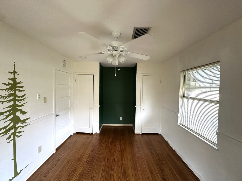903 Lamonte Lane Houston, TX 77018 - Photo 25 of 36 wooden floor in an empty room with a window