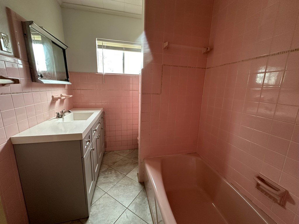 903 Lamonte Lane Houston, TX 77018 - Photo 26 of 36 a bathroom with a sink a toilet and mirror