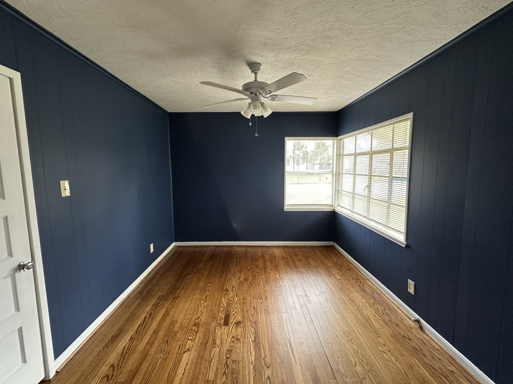 903 Lamonte Lane Houston, TX 77018 - Photo 29 of 36 a view of empty room with wooden floor and fan