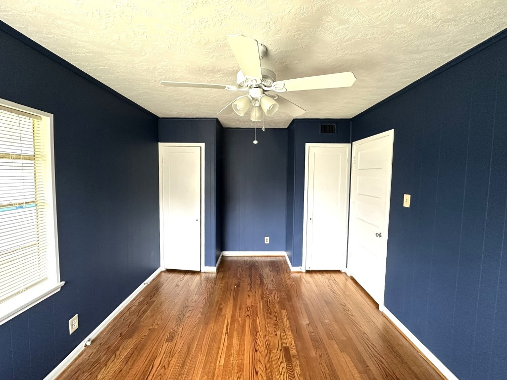 903 Lamonte Lane Houston, TX 77018 - Photo 30 of 36 a view of an empty room with wooden floor and a window