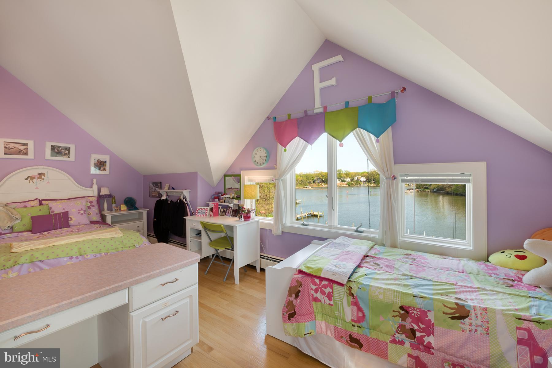 503 Broadwater Road Arnold, MD 21012 - Photo 13 of 30 a bed room with a bed a window and dresser