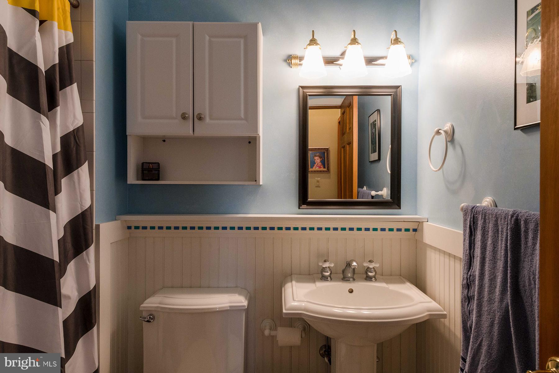 503 Broadwater Road Arnold, MD 21012 - Photo 15 of 30 a bathroom with a sink and a mirror