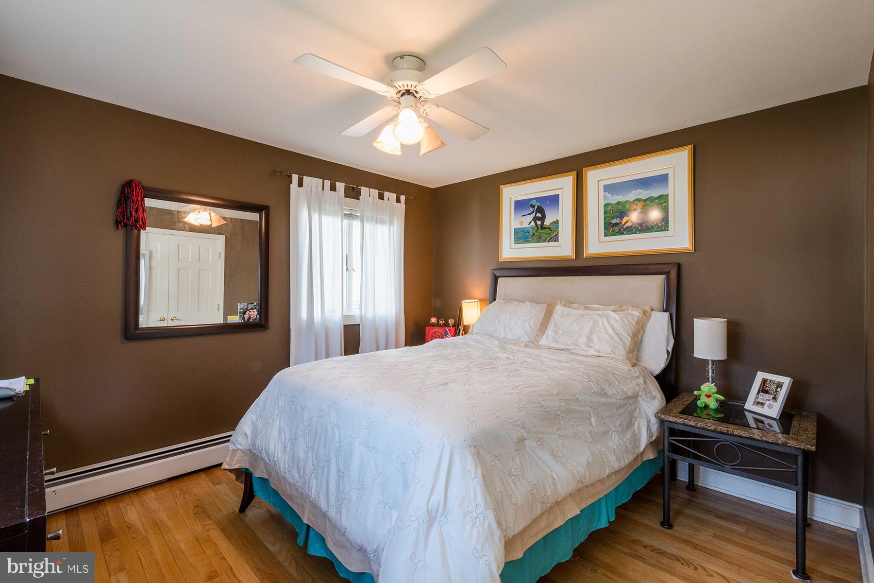 503 Broadwater Road Arnold, MD 21012 - Photo 16 of 30 a bedroom with a bed and a window