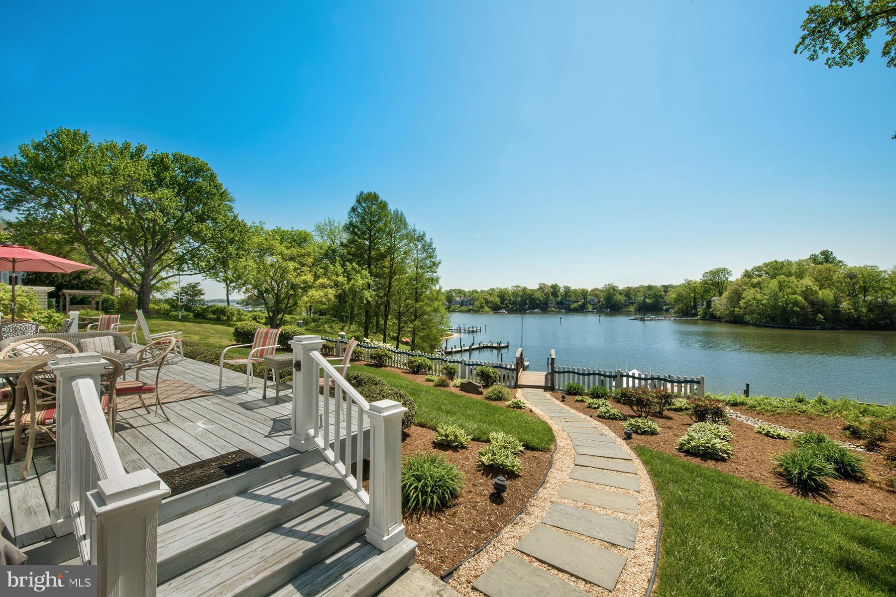 503 Broadwater Road Arnold, MD 21012 - Photo 20 of 30 a view of a lake with outdoor seating