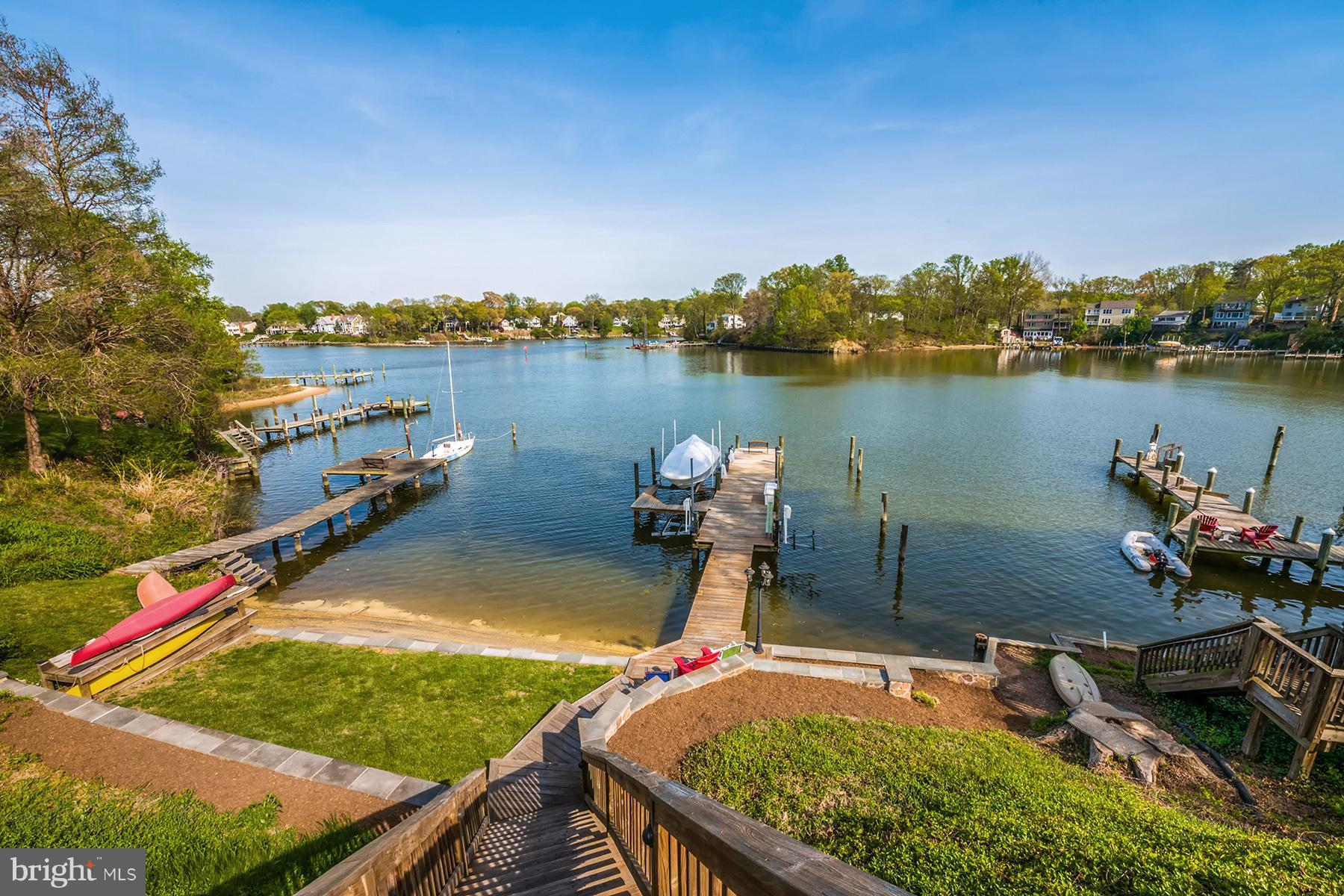 503 Broadwater Road Arnold, MD 21012 - Photo 27 of 30 a view of a lake with a house in the background
