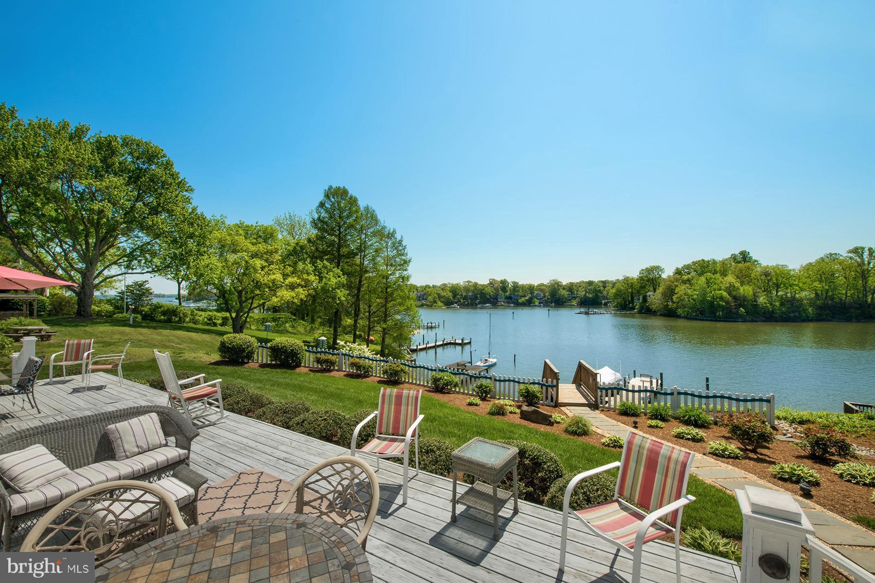 503 Broadwater Road Arnold, MD 21012 - Photo 30 of 30 a view of a patio with couches chairs and a table and chairs with wooden floor and fence