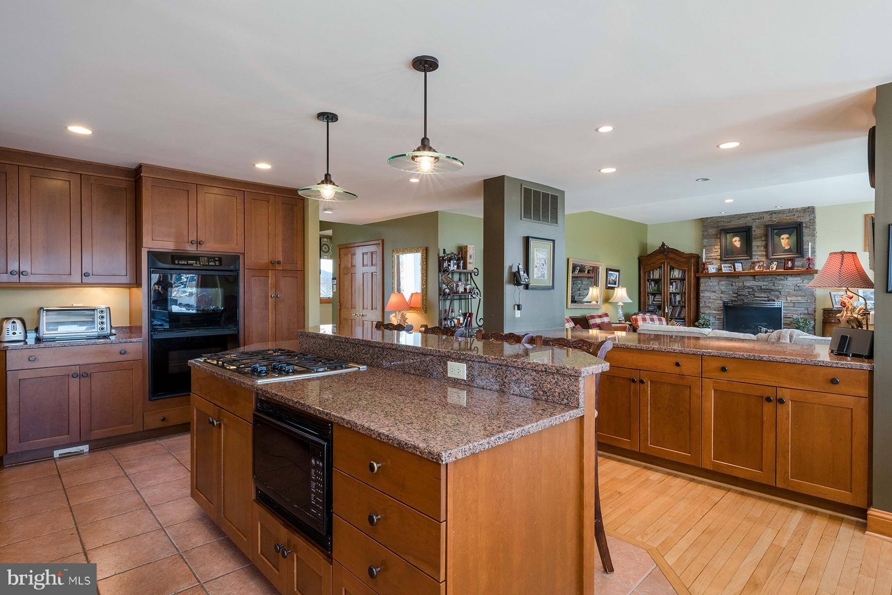 503 Broadwater Road Arnold, MD 21012 - Photo 6 of 30 a kitchen with stainless steel appliances granite countertop a stove and a sink