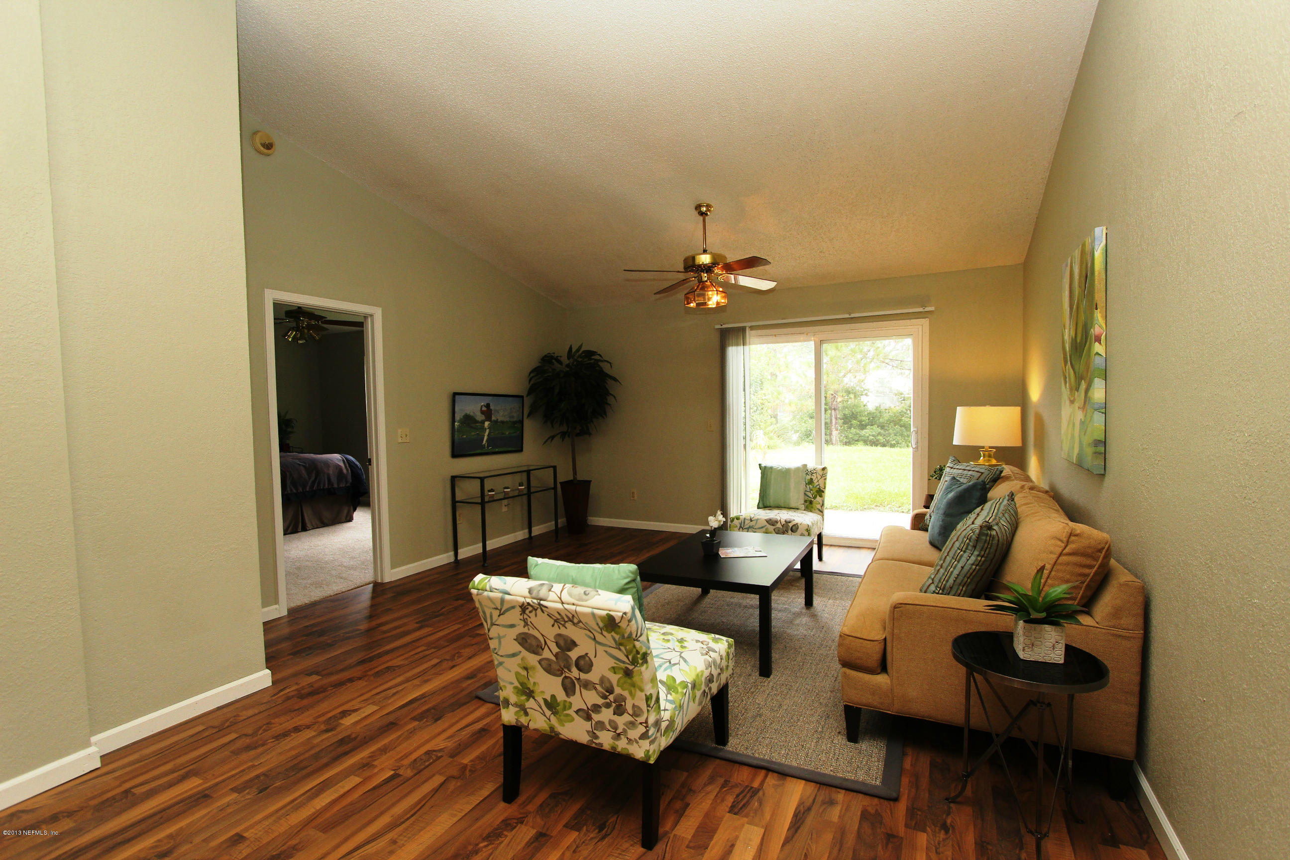 2462 Wattle Tree Road East Jacksonville, FL 32246 - Photo 23 of 35 a living room with furniture and a large window