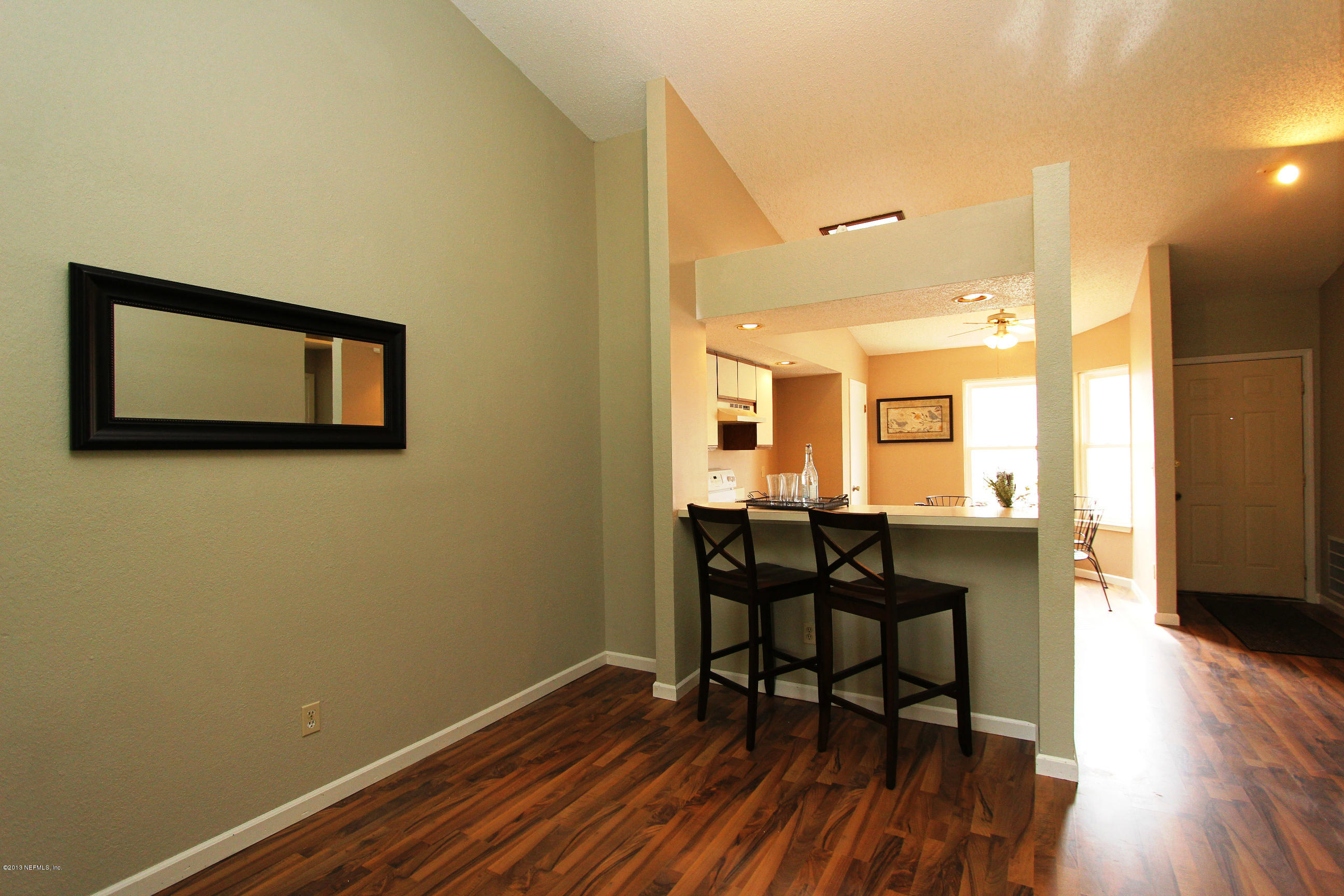 2462 Wattle Tree Road East Jacksonville, FL 32246 - Photo 27 of 35 a view of a dining room with furniture and wooden floor